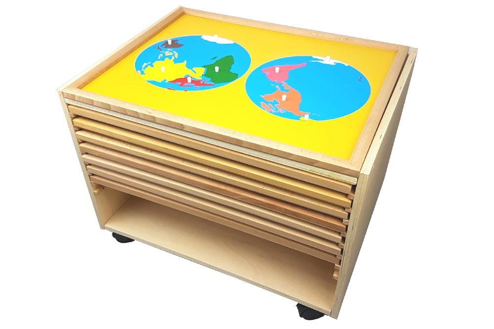 8 puzzle maps with cabinet. The world parts puzzle is on top of the cabinet.