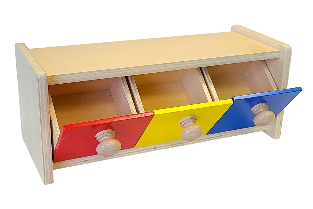 Wooden box with three bins in red, yellow, and blue. All three bins are open, tilting outwards 45°.