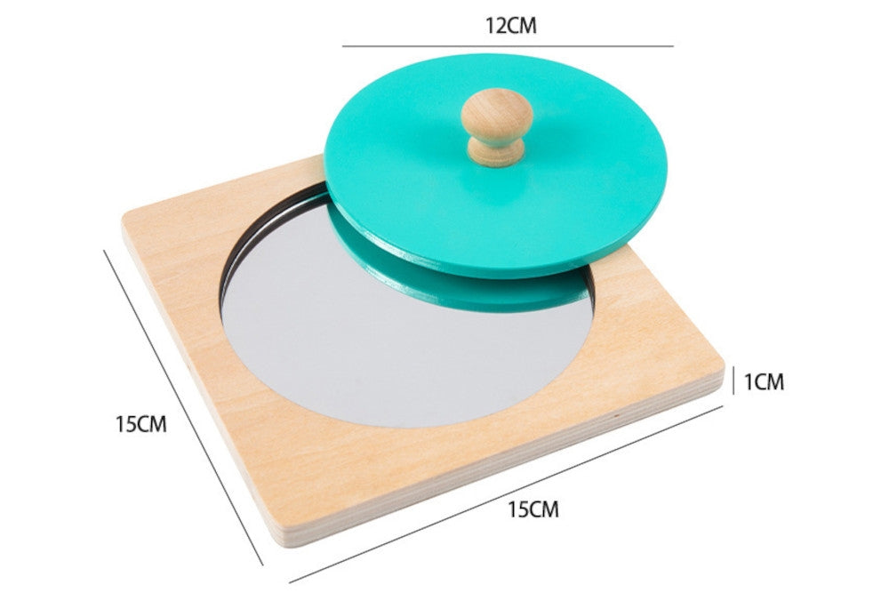 Teal wooden circle puzzle with circular reflective surface on the base. Base measures 15 cm x 15 cm x 1 cm. Circle measures 12 cm in diameter.