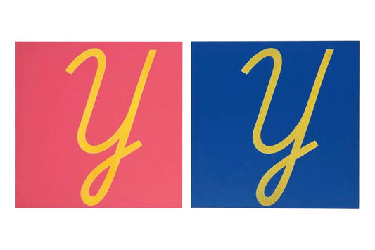 Pink and blue capital case cursive 'Y' sandpaper letters.