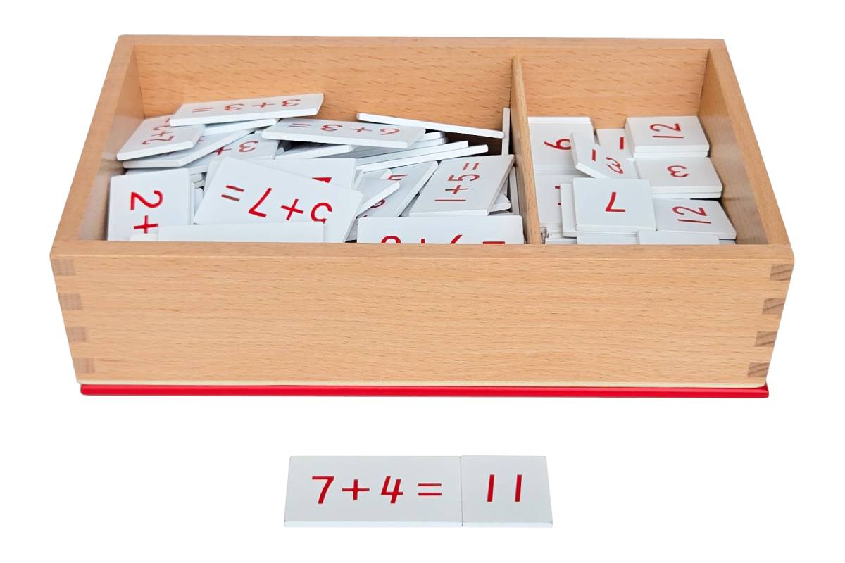 Two-compartment wooden box with addition equation tiles in one compartment and sum answer tiles in the other. Two tiles are laid out: "4+8=" and "12".