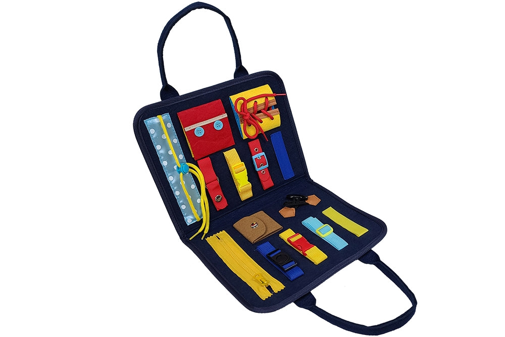 Busy board laid open, displaying various colourful activities inside such as a zipper, buckles, laces, buttons, and drawstring.
