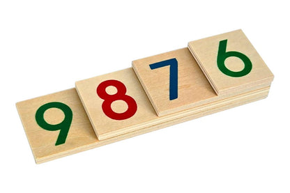 Four wooden number cards stacked together, displaying the numbers 9, 8, 7, and 6 in green, red, blue, and green.