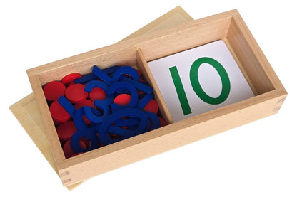 Two-compartment wood box containing number cards with green text on one side and blue numbers and red counters on the other.