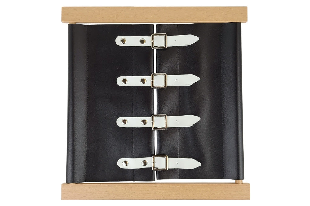 Wooden buckles dressing frame with black fabric and white straps.